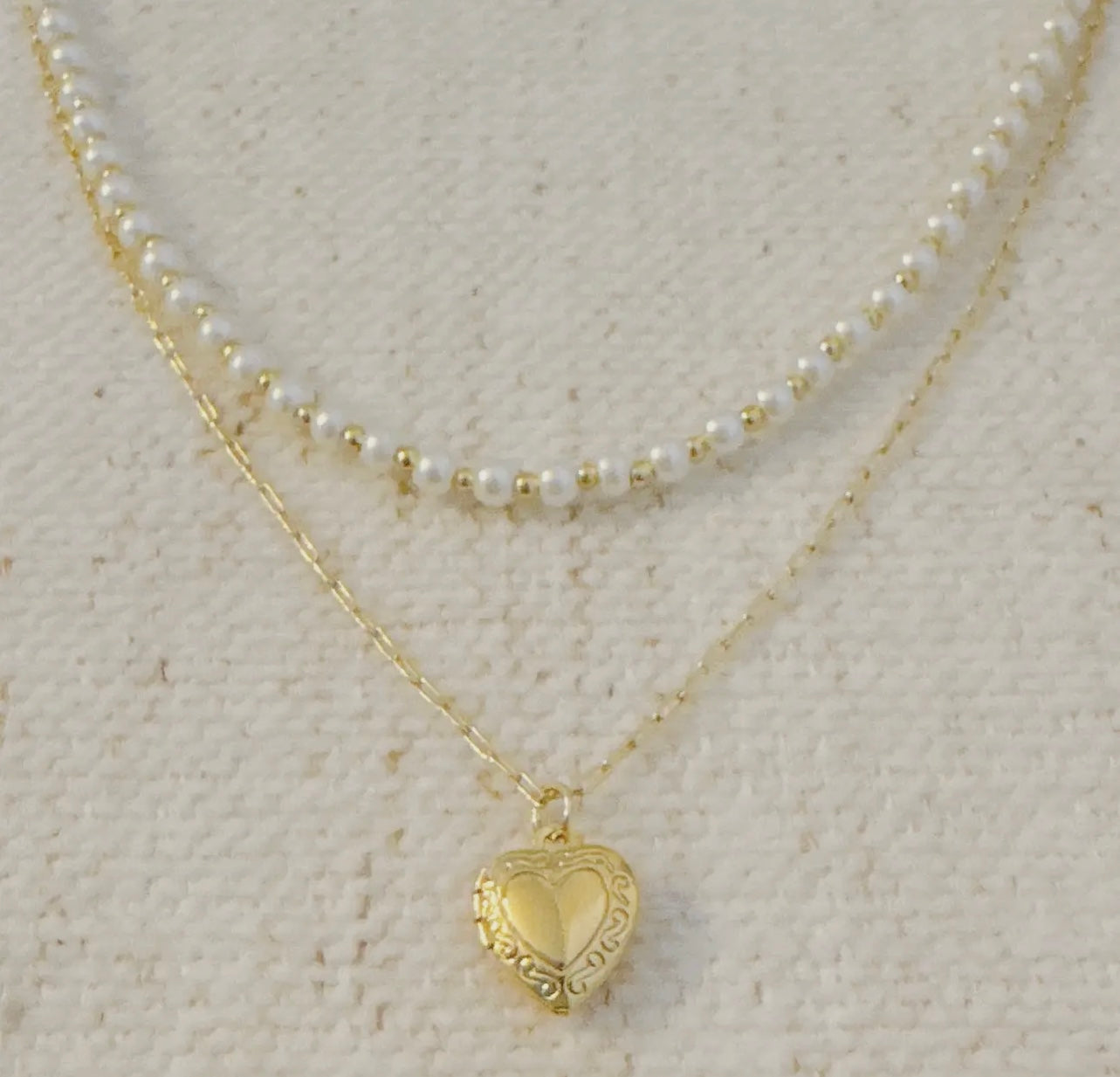 Pearls and heart locket layered necklace