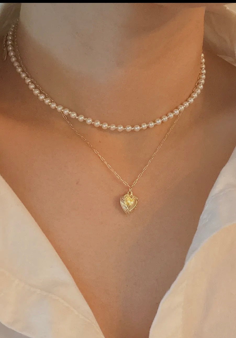 Pearls and heart locket layered necklace