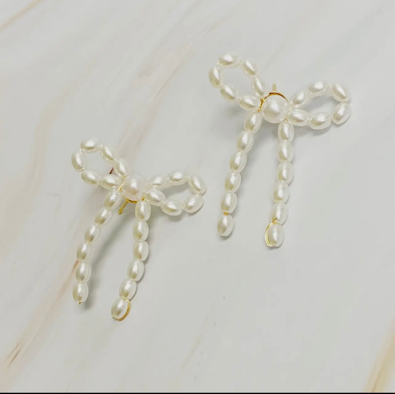 Pearl bow ballerina earrings