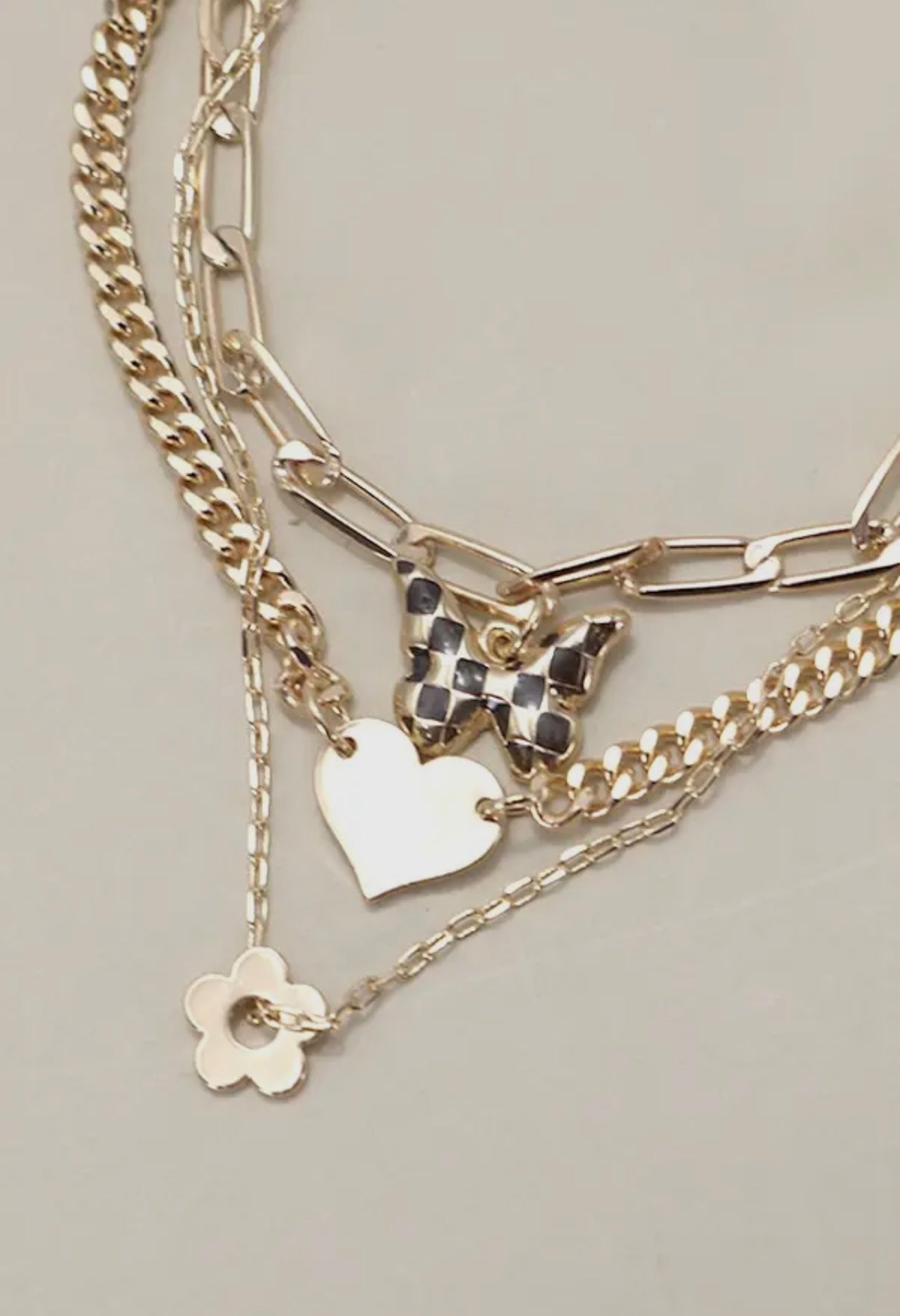 Triple layer flower, heart, butterfly gold bracelet